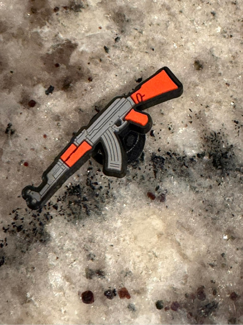 CROCS Orange and Gray Rifle Jibbitz Charm